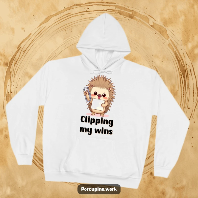 A funny porcupine triumphantly holds an oversized paperclip with a proud smile, symbolizing office victory on this cozy hoodie.