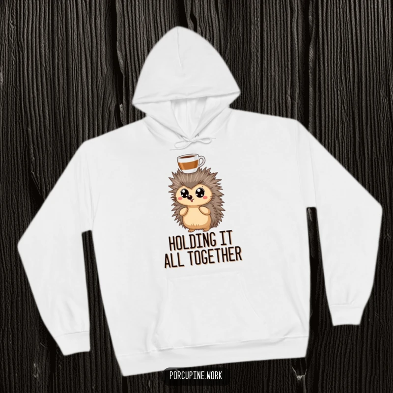 Funny Hoodie showcasing a porcupine with wide, determined eyes, a coffee cup perfectly balanced atop its head, ready to conquer the day.