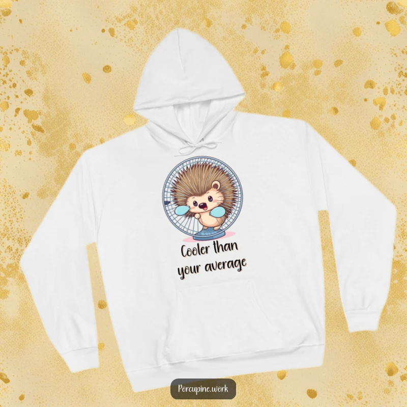 Funny hoodie depicting a porcupine peeking from behind a spinning office fan, offering comfort and humor.