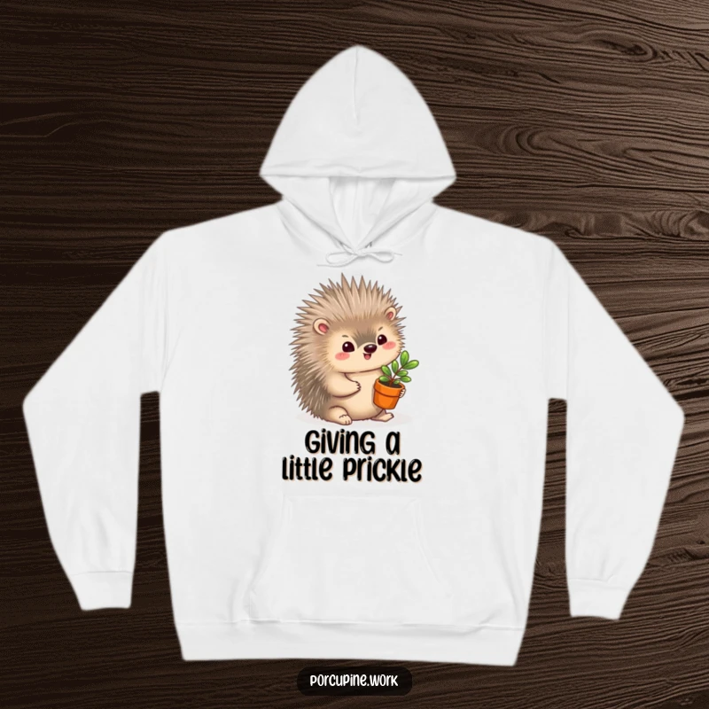 Funny Hoodie: A porcupine gently smiles while offering a miniature potted plant, a symbol of care and humor.