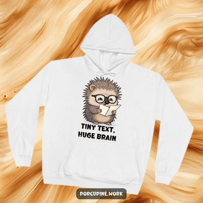 Funny hoodie showcasing a bespectacled porcupine diligently reading a minuscule document, perfect for cozy, intellectual vibes.