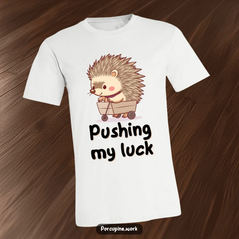 Funny t-shirt depicting a porcupine happily pushing a tiny rolling cart, illustrating a scene of cheerful productivity and fun.