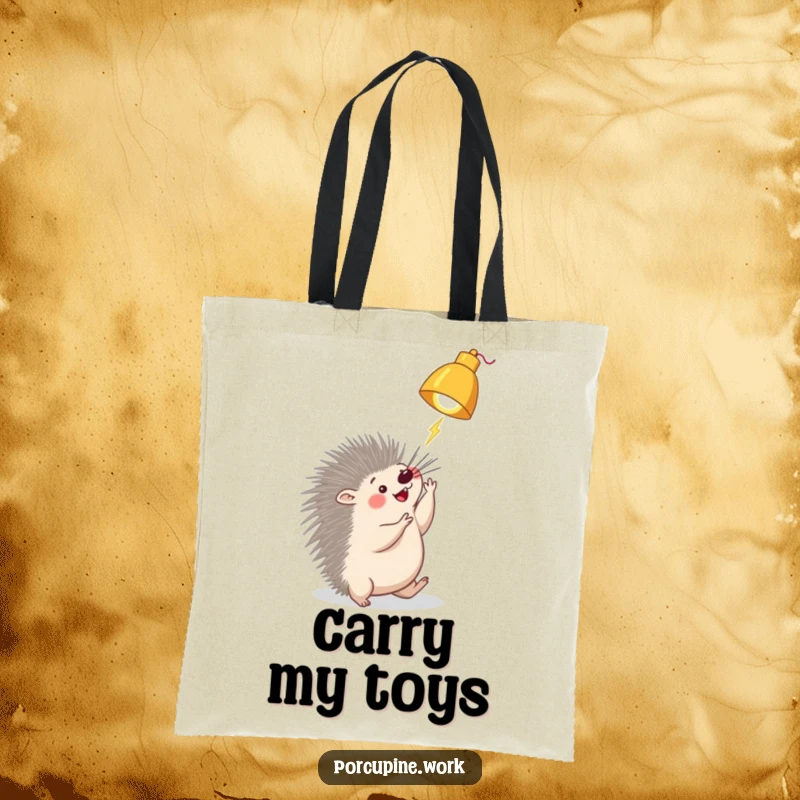 Funny porcupine tote bag with a porcupine playfully batting at a dangling desk lamp, perfect for carrying groceries or books with a smile.