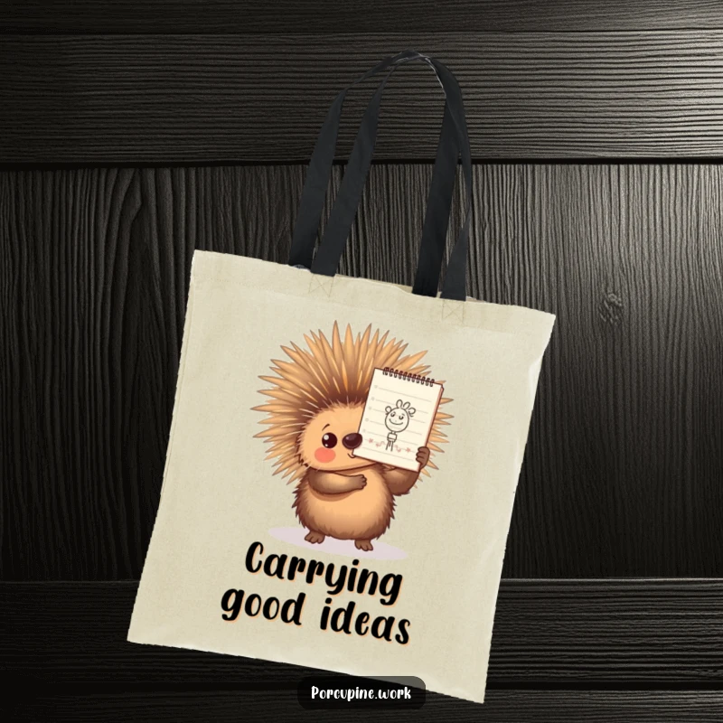 Funny Tote Bag featuring a porcupine proudly displaying a small, detailed doodle on a notepad, perfect for artists on the move.