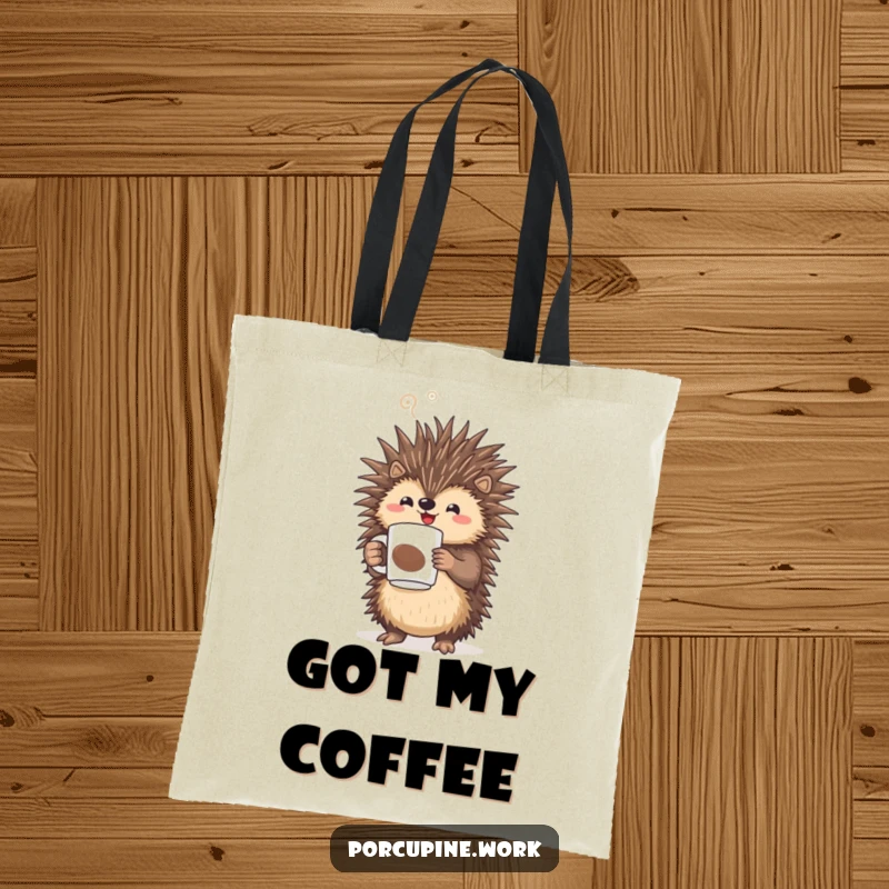 Funny porcupine triumphantly holding a steaming coffee mug on a durable tote bag, ideal for carrying daily necessities.