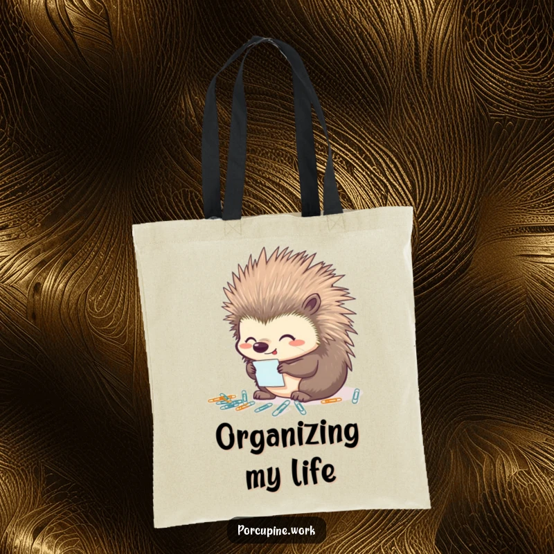 Funny porcupine tote bag showing a porcupine looking pleased while organizing tiny paperclips, perfect for carrying supplies with a sense of order.